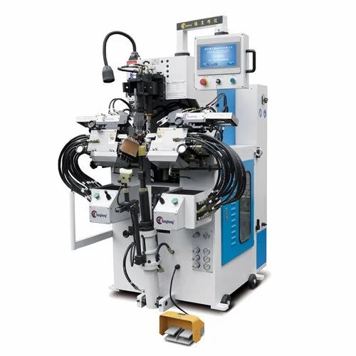 TW-689MA computerized full automatic cementing toe lasting machine featuring robotic arms, hydraulic system, touchscreen control panel, and sturdy frame, designed for high-precision toe lasting in shoe manufacturing. TW-689MA computerized full automatic cementing toe lasting machine featuring robotic arms, hydraulic system, touchscreen control panel, and sturdy frame, designed for high-precision toe lasting in shoe manufacturing.