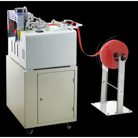 TW-130LR Computerized Tape Cutting Machine Equipped with Both Cold and Hot Knife Blades, Featuring Automated Cutting Controls for Precise Tape and Fabric Processing.