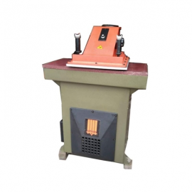 Operator manually using the TW-20C press to cut material by hand, showing hands-on control and precision during operation.