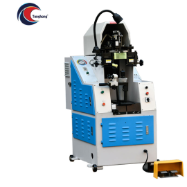 TH-727A Side Lasting Machine Used in Shoe Manufacturing; Equipped With Adjustable Clamps and heating Elements to Shape and Secure the Shoe Upper Along the Sides onto the Last, Featuring a Sturdy Metal Frame and Control Panel.